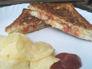 Onion Tomato Chilli Sandwich served with Ketchup and Chips