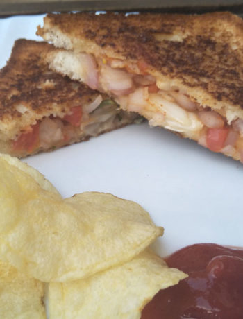 Onion Tomato Chilli Sandwich served with Ketchup and Chips