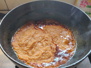 Adding Tomato, Onion, Masala paste to oil