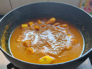 Adding water to Paneer Masala