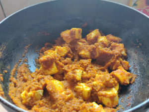 Mixing Paneer Cubes in Dry Gravy