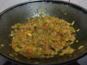 Tomatoes added and fried till the mix starts to release oil